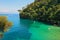 Small bay and cliff covered with trees in Portofino, Italy.