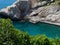 Small bay with crystal clear water surrounded by rocks