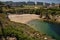 Small beach known by the name of Las Lapas with several bathers seen from the top of the tower of Hercules. Concept landscape,