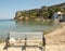 Small beach with lonely bench in Greece