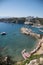 Small beach from top and panoramic shot of the rocks and buildings.