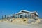 Small beautiful wooden beach pavillon called `Paal 9` on a summer day on island Texel