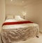 Small bedroom of white walls