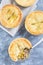 Small beef pot pie or deep dish pie in ramekin, crust broken open, vertical, top view, closeup