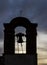 The small bell tower of the Chiesa del Santissimo Crocifisso church in Castagneto Carducci, Livorno, Italy, at sunset