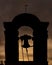 The small bell tower of the Chiesa del Santissimo Crocifisso church in Castagneto Carducci, Livorno, Italy, at sunset