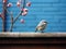 a small bird is sitting on a ledge