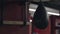 Small black leather punching bag for a boxer training hanging from the ceiling in the gym. Stock footage. Pneumatic