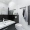 Small black and white bathroom with shower