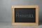 Small blackboard with word Amnesia on grey table