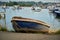 Small blue dinghy in Bembridge Harbour on the Isle of Wight