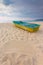 Small boat on the beach with sand sign for writing