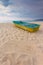 Small boat on the beach with sand sign for writing