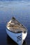 A small boat on a Canadian lake at sunrise