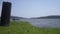 Small boat full of people travels along a peaceful river in Uganda Africa