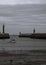 Small boat leaving harbour Whitby North Yorkshire