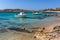 Small boat in Paranga Beach on the island of Mykonos, Greece