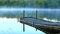 Small boat ramp dock rocking in the early morning light.