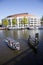 Small boat in river amstel in front of opera house