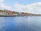 A small boat sails on the rippled waters of Whitby harbour