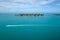 Small Boat Speeds Past Sunset Key and Wisteria Island in Florida Keys