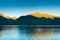 Small boat and sunrise lon calm early morning in Taiya Inlet, Skagway, Alaska.