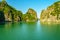 A small boat among the tall karsts in Halong Bay,Vietnam