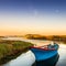 A small boat on the Thau pond in Meze, at sunset, in HÃ©rault, Occitania, France