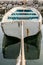 Small boat tied in little marina of Tivat harbor