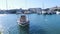 A small boat on the water in the Limassol marina with nice wave reflections on its hull