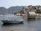 Small boat in the water near Lycian sarcophagus tomb in Kekova island, Antalya, Turkey