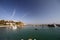 Small boats appearing with the sunrise in the morning sun in ArnavutkÃ¶y, the coastal town of Istanbul.