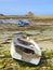 Small boats on beach at low tide