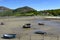 Small boats on the beach at low tide, at the Welsh village of Trefor on the Llyn peninsula.