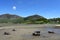 Small boats beached on the sands at low tide at the Welsh village of Trefor on the Llyn peninsula.