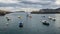 Small boats at the entrance of the fishing port of Bermeo on the coast of Vizcaya on a cloudy day