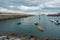 Small boats at the entrance of the fishing port of Bermeo on the coast of Vizcaya on a cloudy day