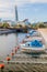 Small boats at Turbinkanalen canal in Malmo, Sweden. Turning Torso building in the backgroun