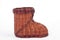 A small boot shaped wicker backet on white background