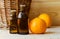 Small bottle with mandarin orange essential oil clementine extract, tincture, infusion, perfume. Aromatherapy and spa
