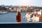 A small bottle of porto wine, on the background of the panorama of Porto, Portugal. Selective focus, Blurred Background