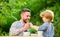 Small boy child with dad. father and son eat outdoor. they love eating together. Weekend breakfast. healthy food. Family