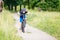 Small boy in helmet riding bicycle in park