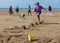 Small boy jumping sandcastles on the beach August 2018