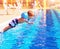 Small boy jumping to the pool