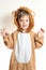 Small boy in lion coat with claws fingers