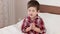 Small boy praying, kid saying prayer before going to bed, strong belief in heart, boy praying to god