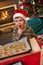 Small boy tasting christmas cake