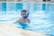Small boy training snorkelling in swimming pool