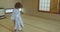 Small boy twists, twirls and dances while wearing traditional yukata